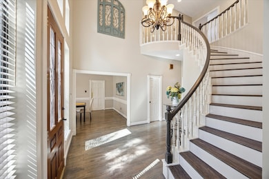 Enter this stunning home through a soaring foyer w