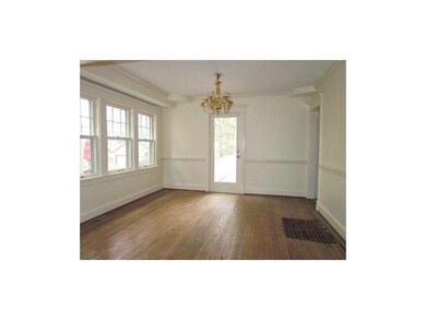 Dining room is filled with light and  enters to a 