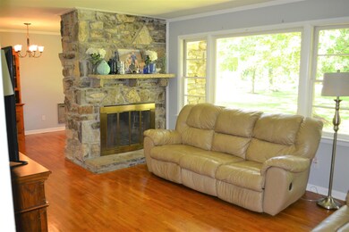 Living rm w/stone fireplace and gas logs