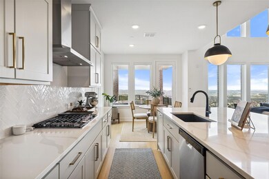 Kitchen with range hood, appliances with stainles