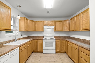 Expansive countertops enhance this kitchen's funct