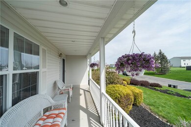 Covered porch, large enough for your summer time furniture and just in time to enjoy for the spring/summer