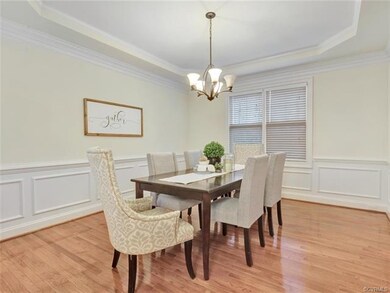 Formal dining room with trey ceiling detail and wa