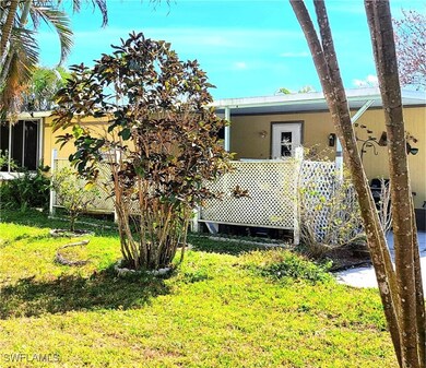 Back of property featuring a yard where a small fe