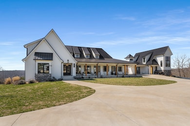 A once-in-a-lifetime chance to own a rare 47-acre retreat, featuring a breathtaking estate with pool, a charming party barn overlooking a serene stocked pond, a functional working garage, and a welcoming guest house—truly an extraordinary retreat