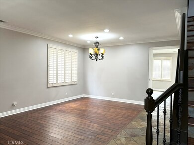 Formal Dining and Living Room with beautiful floors and plantation shutters