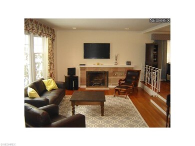 Unique step down living room features hardwood flo
