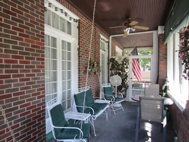 Large screened front porch with swing.