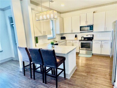 Kitchen with stainless steel appliances, tasteful 