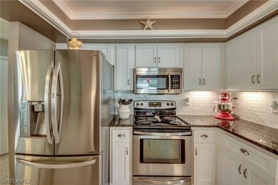 Newer stainless refrigerator/freezer has dual ice makers! Classic white cabinetry compliments the black granite counters in the kitchen. Exhaust fan above microwave takes food odors out of the house.