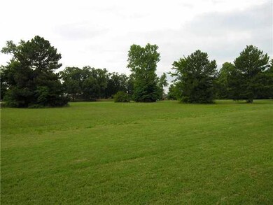 To your left is a large open field owned by the ch