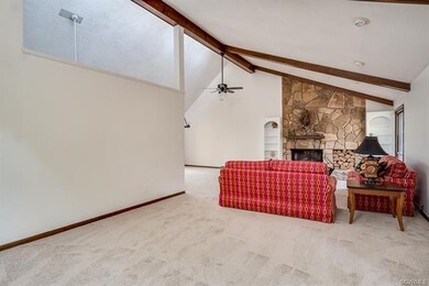 FAMILY ROOM OFFERS DRAMATIC VAULTED CEILINGS AND R