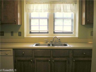 Kitchen. Modern details through out including updated faucet and decorative switch plates.