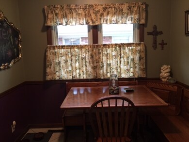 The kitchen eating area has a negotiable oak break