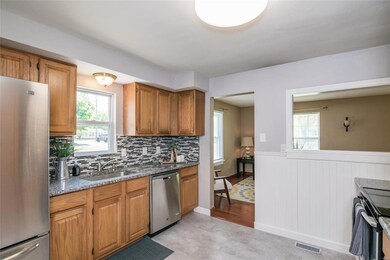 Beautifully remodeled kitchen with granite counter-tops, stainless steel appliances, new flooring and a modern waterproof vinyl tile.
