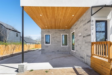 View of patio with fence