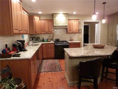Kitchen has custom cabinets by both B & H Cabinets