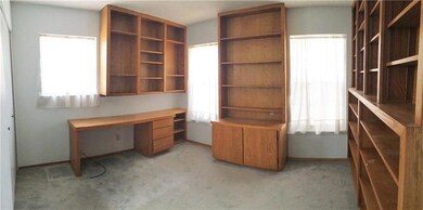 The second of three ample bedrooms featu