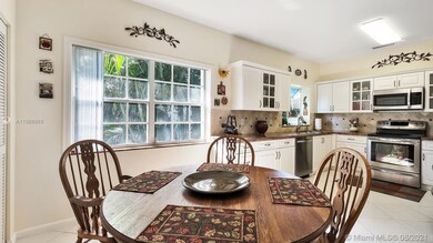 Eat-In-Kitchen Features Lovely Wood Cabinets