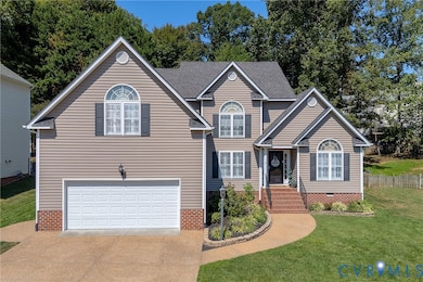 Traditional-style house with an attached garage, driveway, and crawl space