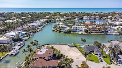 Drone / aerial view featuring a water view and a r