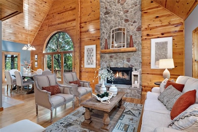 Grand 2 story fireplace is the focal point of the 