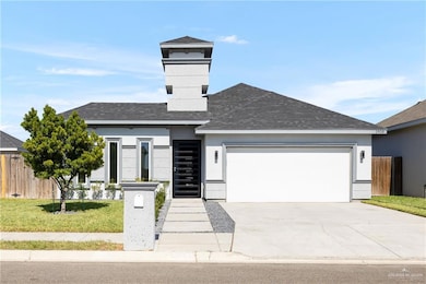 View of front of home featuring roof with shingles, stucco siding, concrete driveway, and an attached garage