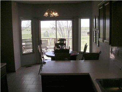 View of Dining From Kitchen * Entry to Wood Deck