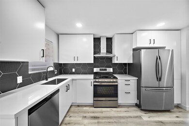 The remodeled kitchen stands out with sleek cabine