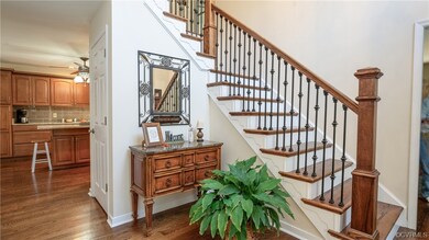 Stairs featuring dark wood-type flooring and ceili