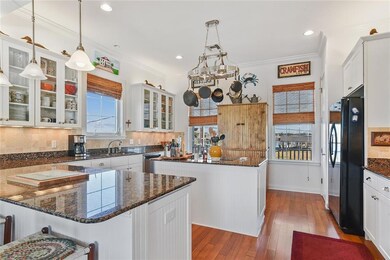 Granite counter tops and wood floors in show quali
