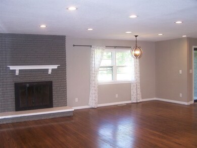 27 x 26, Wood Flooring. Front entrance is to the r