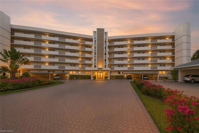 Property at dusk featuring a view of apartment building / complex