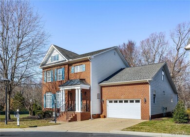 View of front of home with an attached garage, a s