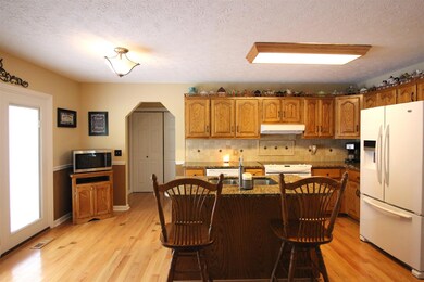 Looking into the kitchen and showing off those arched entries.