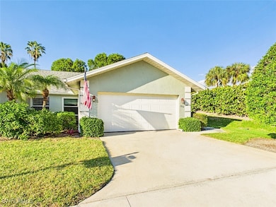 Ranch-style home with a garage, concrete driveway,