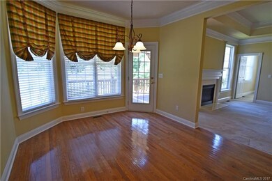 sunny breakfast area.  beautiful hardwood floors h