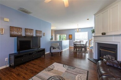 Living Room with fireplace and view of Dining Area