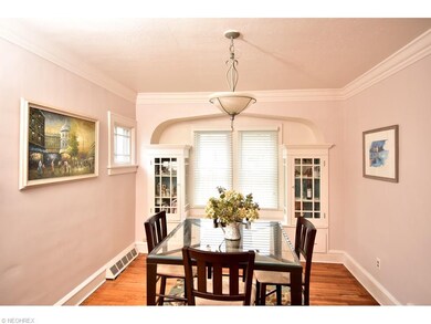 The dining room features built in china cabinets a