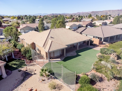 Aerial perspective of suburban area featuring a mountain backdrop