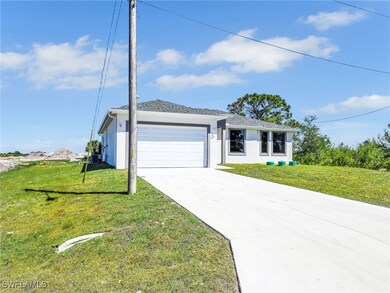 Single story home featuring a garage, driveway, st