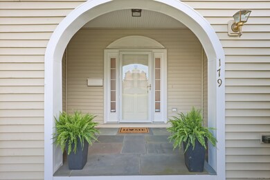A lovely front porch with bluestone welcomes guest