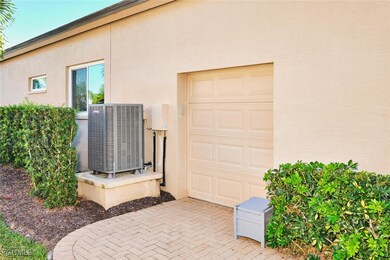 View of home's exterior with stucco siding and a cooling unit