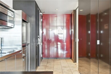 Corridor with light tile patterned floors