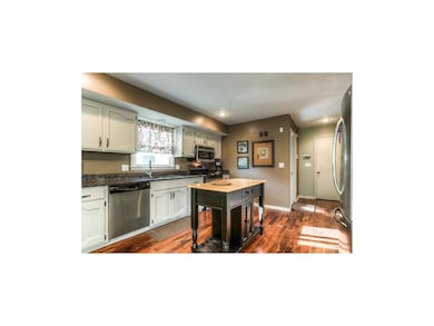 Large updated kitchen with lovely hardwoods, grani
