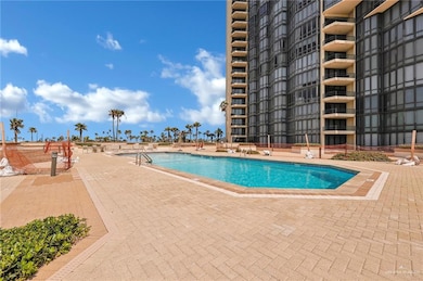 Community pool with a patio area