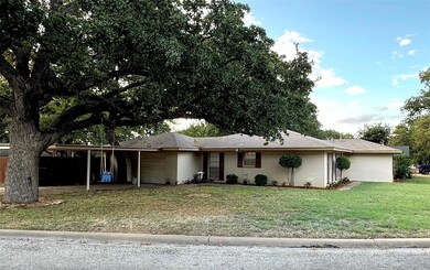 Ranch-style home with a front yard