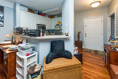 View of front Door and kitchen area