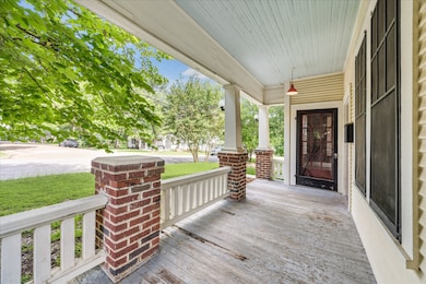 The front porch has brick columns and the traditio