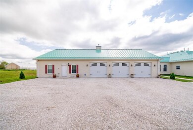 VIEW OF CARRIAGE HOUSE & 3 CAR GARAGE...